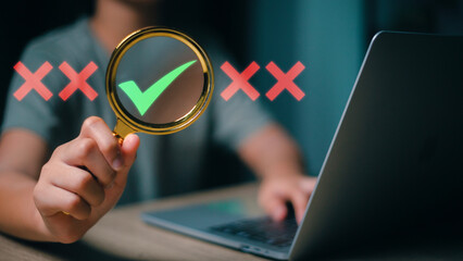 Focusing on the right choice concept. Hand holds magnifying glass focusing on the checkmark or tick right symbol next to wrong cross icons.