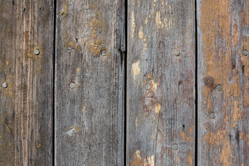 wooden background with weathered wood and ruusty nails