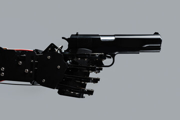 Real robot's hand with handgun. Concept of AI takeover and technological singularity