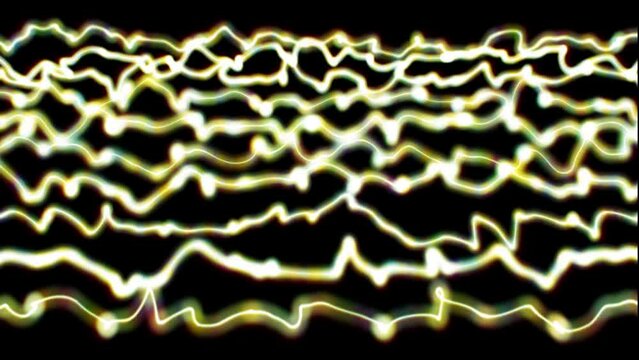 abstract waves of yelow color on a black background slow motion