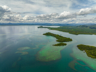 Top view of coast with rainforest and tropical islands in the bay. Borneo. Sabah, Malaysia.