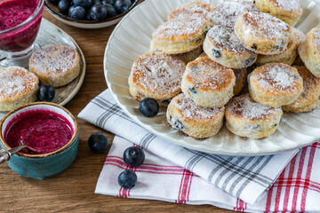 Traditional fennel Welsh cakes with blueberry coulis