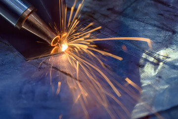 Close up scene the welding process with the sparking light.