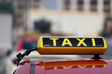 taxi sign on the car