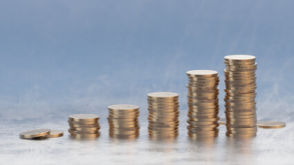 Coin stacks, money grow up