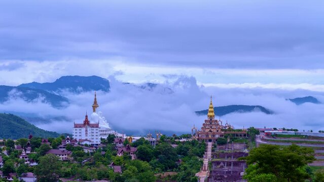 timelapse mist are moving around beautiful golden pavilion and the beautiful 5 statues buddha of Wat Phachonkeaw. .the famous landmark of Phetchabun province Thailand. mist in the valley background