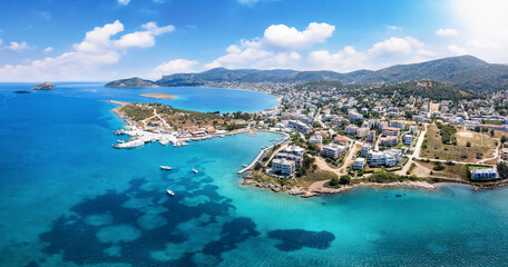 Naklejka na ściany i meble Panoramic aerial view of the beautiful town and bay of Porto Rafti, popular destination for Athenians during summer time, Attica, Greece