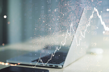 Double exposure of abstract creative financial chart with world map on laptop background, research...