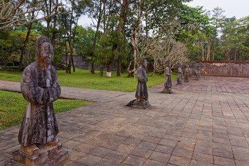 Stone statues of civil  officers, military officers, horse and elephant inside the Emperor Minh Mang Tomb in Hue, Vietnam.