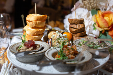 assorted snacks with bruschetta and pate on the festive table
