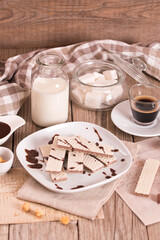 Neapolitan wafers filling with hazelnut-chocolate cream. - 607098748