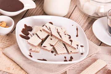 Neapolitan wafers filling with hazelnut-chocolate cream. - 607098773