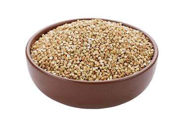 Unroasted buckwheat in a bowl. Useful dietary product. Isolated on a white background.