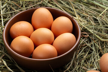 Homemade chicken eggs in a clay plate