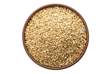 Unroasted buckwheat in a bowl. Isolated on a white background.