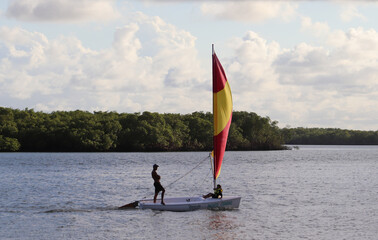 Fototapeta premium Close-up of a person windsurfing calmly on the river