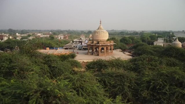 drone filming at sunset, sacred place kusum sarovar on govardhan hill, temple in india, place of pilgrimage