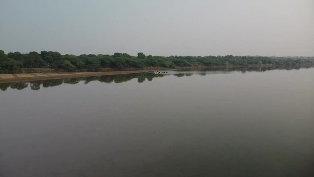 drone filming at sunset, sacred river yamuna in vrindavan in india, place of pilgrimage, holy place