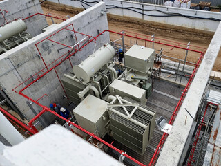 Power plant construction, the activity of workers at power transformer area.