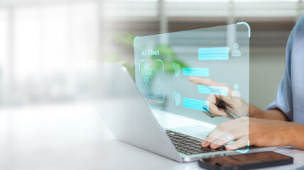Business man using digital chatbot application Artificial Intelligence (AI) at home for online customer service. AI Chat Technology for Seamless Communication and Customer Engagement.