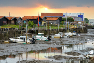View of the town (commune) of Gujan-Mestras at low tide of the Atlantic Ocean in the Arcachon Bay in France