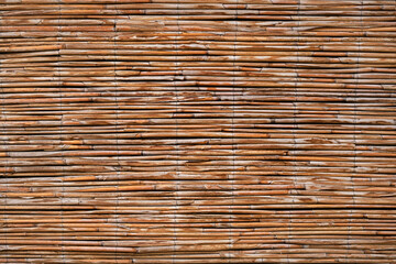 Abstract background of reed or straw branches.