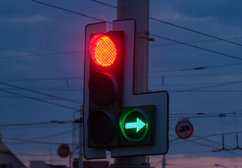 Traffic light on the background of the evening city.