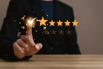 Virtual image scenario for evaluating customer satisfaction levels with device system. Ratings stars, reviews, survey responses. happy, information. Man touching check mark on wood desk in office