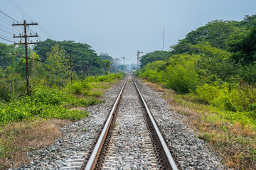 Fototapeta na wymiar railway in the countryside at Ban Dara, Pichai District, Uttaradit, Thailand. Railway tracks at Paramin Bridge also known as Baan Dara Bridge It is a railway bridge over the Nan River