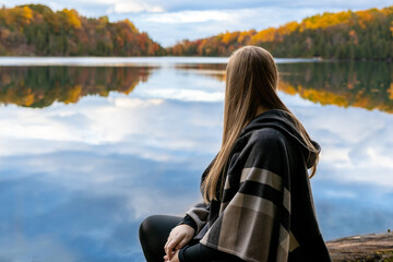 Woman Staring Out Over a Lake