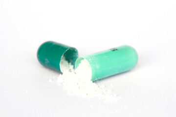 medicine capsule Green on white background