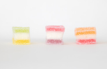 sugar coated jelly with beautiful colors on white background with copy space
