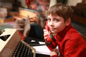 Child posing with retro phone