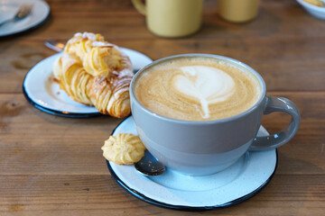 Morning Delights: Coffee, Croissant, and Milk Art
