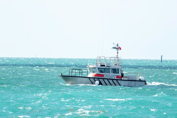 A pilot boat heading out of the channel to guide a cruise ship in Key West. 
