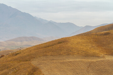 Mountains with visible silhouettes through the morning fog, mount background