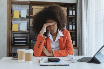 Young African American businesswoman stress from work at office workplace, feeling sick at work,...