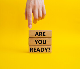 Are you ready symbol. Concept word Are you ready on wooden blocks. Businessman hand. Beautiful...