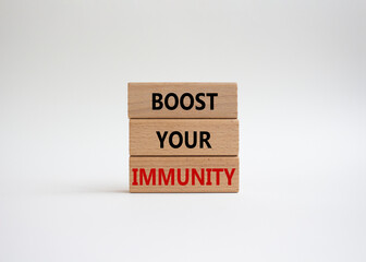 Boost your immunity symbol. Concept word Boost your immunity on wooden blocks. Beautiful white background. Helthcare and Boost your immunity concept. Copy space