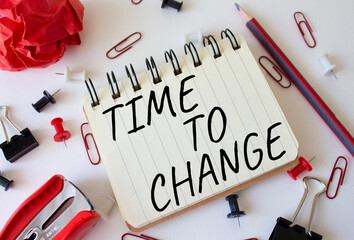 Time to change symbol. Concept words Time to change on wooden notebook. Beautiful white background....