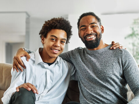 father son family man child portrait parent boy happy together teen love dad togetherness hugging male bonding care black home childhood teen teenager adolescence