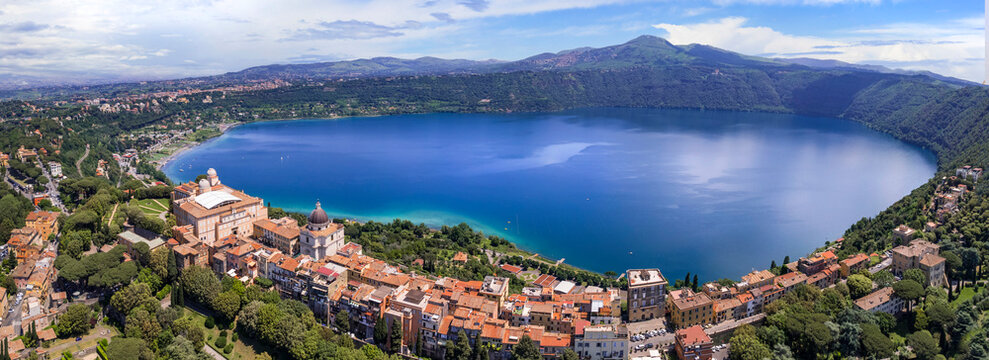 Most scenic lakes of Italy - volcanic Albano lake , aerial drone view of Castel Gandolfo village and crater of volcno. popular touristic site near Romem, famous as Pope residense