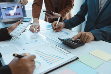 Professionals business team meeting  conference with project planning document analysis and investment decision making at office workplace. Team of asian business working together.