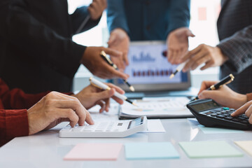 Professionals business team meeting  conference with project planning document analysis and investment decision making at office workplace. Team of asian business working together.