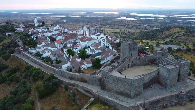 Aerial view of Monsaraz a tiny charming village inside castle walls in Alentejo region of Portugal, at sunrise