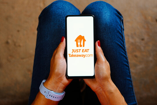 May 28, 2023, Brazil. In this photo illustration, the Just Eat Takeaway logo is displayed on a smartphone screen.