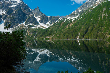 Fototapeta na wymiar beautiful landscape view of Lake Morskie Oko in the mountains with clear water and reflection in Zakopane Poland in the Tatra National Park