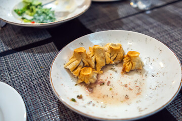 Leftovers on a plate from khinkali that were eaten