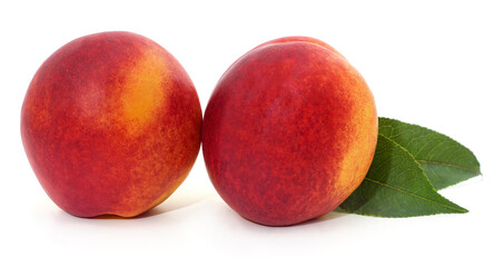 Two nectarines and leaves.