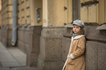 Fototapeta na wymiar Girl walking on street of Saint-Petersburg 